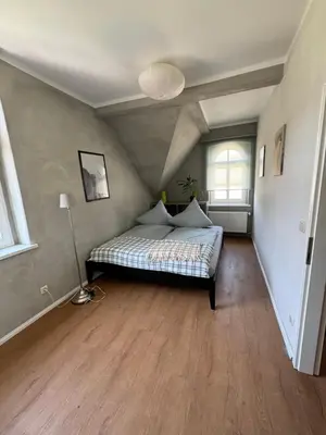Ein Bett oder Betten in einem Zimmer der Unterkunft Altstadtquartier Hagenstraße