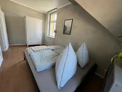 Ein Bett oder Betten in einem Zimmer der Unterkunft Altstadtquartier Hagenstraße