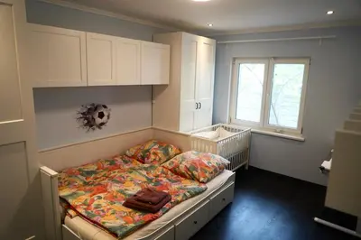 Ein Bett oder Betten in einem Zimmer der Unterkunft Berlin Bound Retreat 3 bedrooms