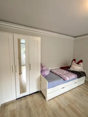 Ein Bett oder Betten in einem Zimmer der Unterkunft Ferienwohnung