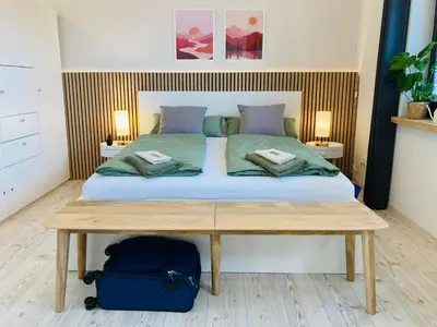 Ein Bett oder Betten in einem Zimmer der Unterkunft StudioIModernIZentrumIWLANIParkplatzIDisneyPlus