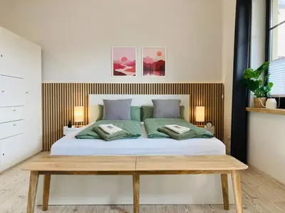 Ein Bett oder Betten in einem Zimmer der Unterkunft StudioIModernIZentrumIWLANIParkplatzIDisneyPlus