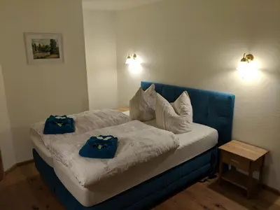 Ein Bett oder Betten in einem Zimmer der Unterkunft Landgasthof Askanien