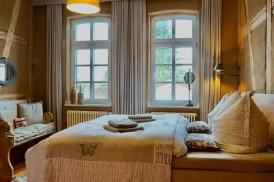 Ein Bett oder Betten in einem Zimmer der Unterkunft Ferienwohnung Alte Schule Chorin Schorfheide