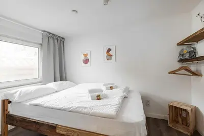 Ein Bett oder Betten in einem Zimmer der Unterkunft Cabin by the lake for 4 people with Fireplace and Sauna