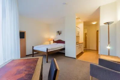 Ein Bett oder Betten in einem Zimmer der Unterkunft Apartmenthaus Berlin Mitte