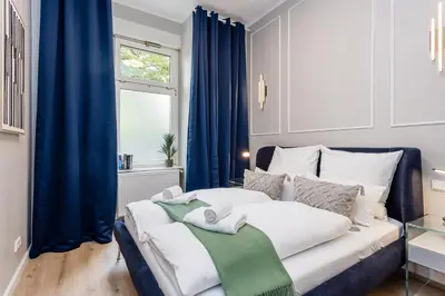 Ein Bett oder Betten in einem Zimmer der Unterkunft Luxuriöse Design Apartments mit je 3 Schlafzimmern