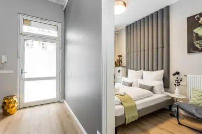 Ein Bett oder Betten in einem Zimmer der Unterkunft Luxuriöse Design Apartments mit je 3 Schlafzimmern