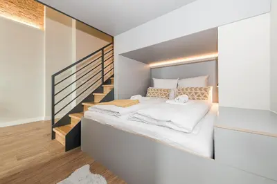 Ein Bett oder Betten in einem Zimmer der Unterkunft Exklusives Designer Loft nahe Hauptbahnhof