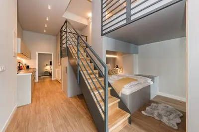 Ein Bett oder Betten in einem Zimmer der Unterkunft Exklusives Designer Loft nahe Hauptbahnhof