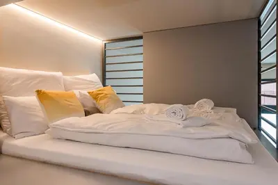 Ein Bett oder Betten in einem Zimmer der Unterkunft Exklusives Designer Loft nahe Hauptbahnhof
