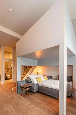 Ein Bett oder Betten in einem Zimmer der Unterkunft Exclusives Cube loft nahe Hauptbahnhof