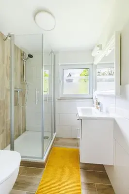 Ein Badezimmer in der Unterkunft Ferienhaus Goldene Zeit I Terasse I Parkplatz I 3 SZ I 2 Bäder I 2 min zum See