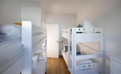 Ein Bett oder Betten in einem Zimmer der Unterkunft FEWO PARTNERS - Fewo California Dreaming 93 qm mit Garten in Wildau Nähe BER-Airport