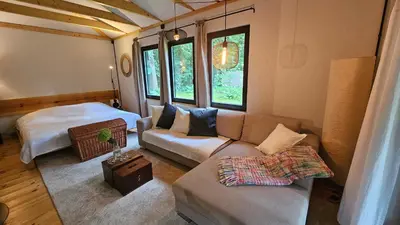 Ein Bett oder Betten in einem Zimmer der Unterkunft Kleine Auszeit - Cottage im Grünen