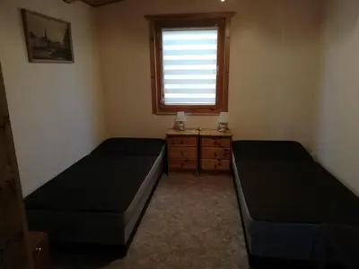 Ein Bett oder Betten in einem Zimmer der Unterkunft Sommerferienhaus Jeannette