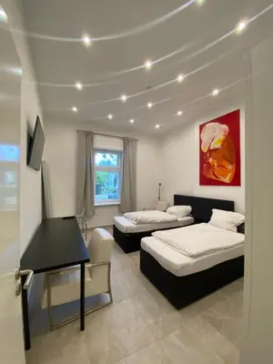 Ein Bett oder Betten in einem Zimmer der Unterkunft Villa Wittenau Ferienwohnung EG