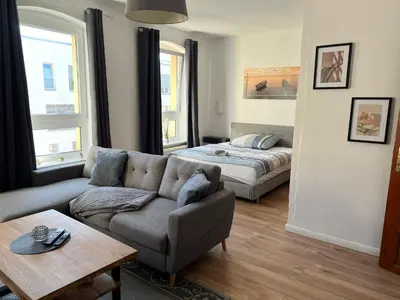 Ein Bett oder Betten in einem Zimmer der Unterkunft Altbauapartment in Wassernähe und Magenta TV