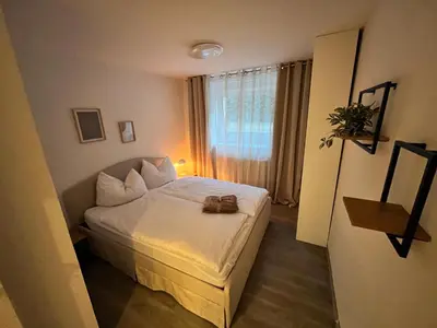 Ein Bett oder Betten in einem Zimmer der Unterkunft Apartment Hukic mit 2 Schlafzimmer