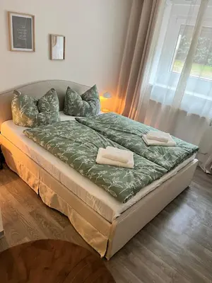 Ein Bett oder Betten in einem Zimmer der Unterkunft Apartment Hukic mit 2 Schlafzimmer