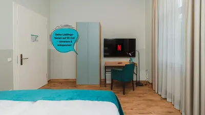 Ein Bett oder Betten in einem Zimmer der Unterkunft H24 Hotel Apartments Eberswalde