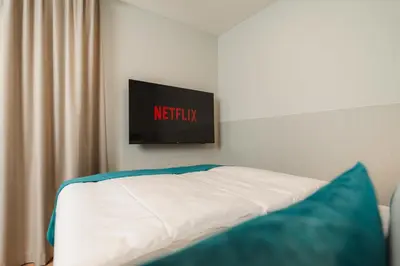 Ein Bett oder Betten in einem Zimmer der Unterkunft H24 Hotel Apartments Eberswalde