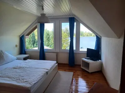 Ein Bett oder Betten in einem Zimmer der Unterkunft Ferienhaus am Bauernsee