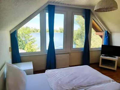 Ein Bett oder Betten in einem Zimmer der Unterkunft Ferienhaus am Bauernsee