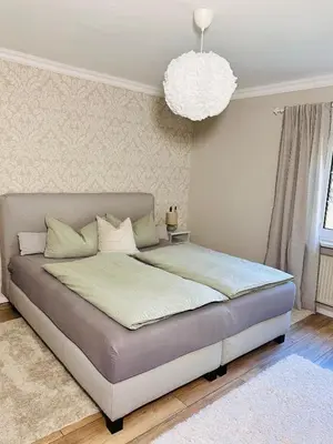 Ein Bett oder Betten in einem Zimmer der Unterkunft Perfekte Auszeit - Charmantes Ferienhaus Neuenhagen bei Berlin