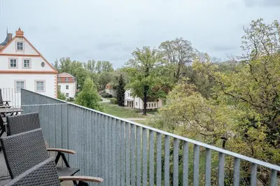 Ein Balkon oder eine Terrasse in der Unterkunft Ferienwohnungen in der Wassermühle am Schloss