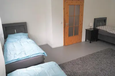 Ein Bett oder Betten in einem Zimmer der Unterkunft Vereinbarkeit Familie und Beruf