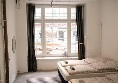 Ein Bett oder Betten in einem Zimmer der Unterkunft Urban Loft in Vibrant Kreuzkölln