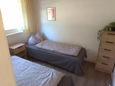 Ein Bett oder Betten in einem Zimmer der Unterkunft Ferienhäuser am Mühlenberg