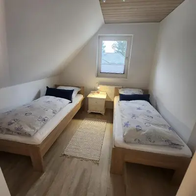 Ein Bett oder Betten in einem Zimmer der Unterkunft Ferienhaus LEMA