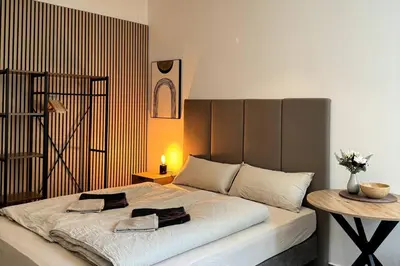 Ein Bett oder Betten in einem Zimmer der Unterkunft Kleines stilvolles Apartment
