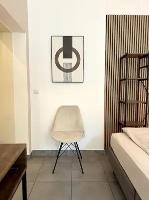 Ein Bett oder Betten in einem Zimmer der Unterkunft Kleines stilvolles Apartment
