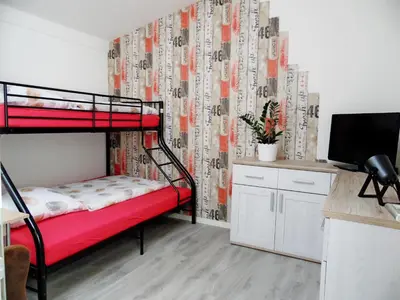 Ein Bett oder Betten in einem Zimmer der Unterkunft Gästehaus Sonnenschein in Nauen - nahe Berlin