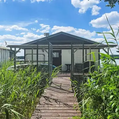 Chalet Bootshaus auf dem See by Interhome