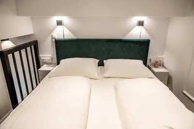 Ein Bett oder Betten in einem Zimmer der Unterkunft Oran Apartment 2