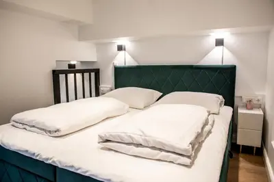 Ein Bett oder Betten in einem Zimmer der Unterkunft Oran Apartment 2