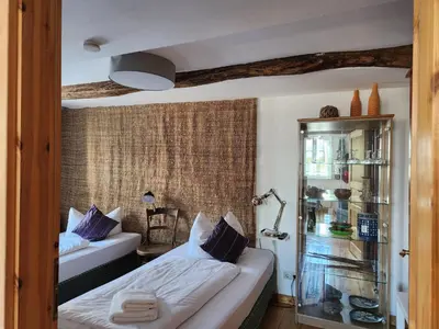 Ein Bett oder Betten in einem Zimmer der Unterkunft Ferienwohnungen Hakenbuden