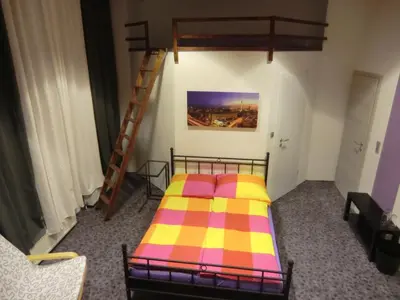 Ein Bett oder Betten in einem Zimmer der Unterkunft Cityflair Berlin Apartments & Rooms