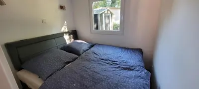 Ein Bett oder Betten in einem Zimmer der Unterkunft Ferienhaus direkt am See mit Boot, Fahrrädern und Sup