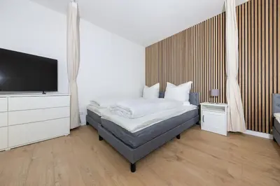 Ein Bett oder Betten in einem Zimmer der Unterkunft Zentrales Gallerie-Loft Alexanderplatz