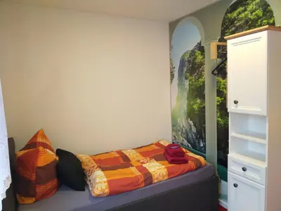 Ein Bett oder Betten in einem Zimmer der Unterkunft Ferienwohnung Baer 2