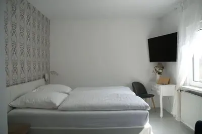 Ein Bett oder Betten in einem Zimmer der Unterkunft Ferienwohnung Elfriede im Haus Namenlos