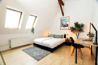 Ein Bett oder Betten in einem Zimmer der Unterkunft Helle & gemütliche Dachwohnung mit Terasse