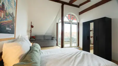 Ein Bett oder Betten in einem Zimmer der Unterkunft Helle & gemütliche Dachwohnung mit Terasse