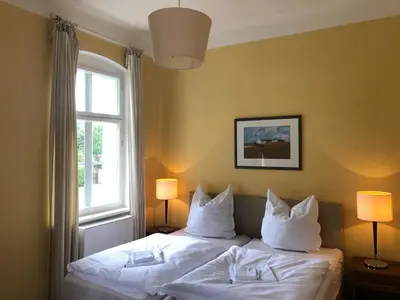 Ein Bett oder Betten in einem Zimmer der Unterkunft Schönewalde Appartement 1