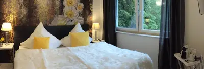 Ein Bett oder Betten in einem Zimmer der Unterkunft Charming Apartments am See